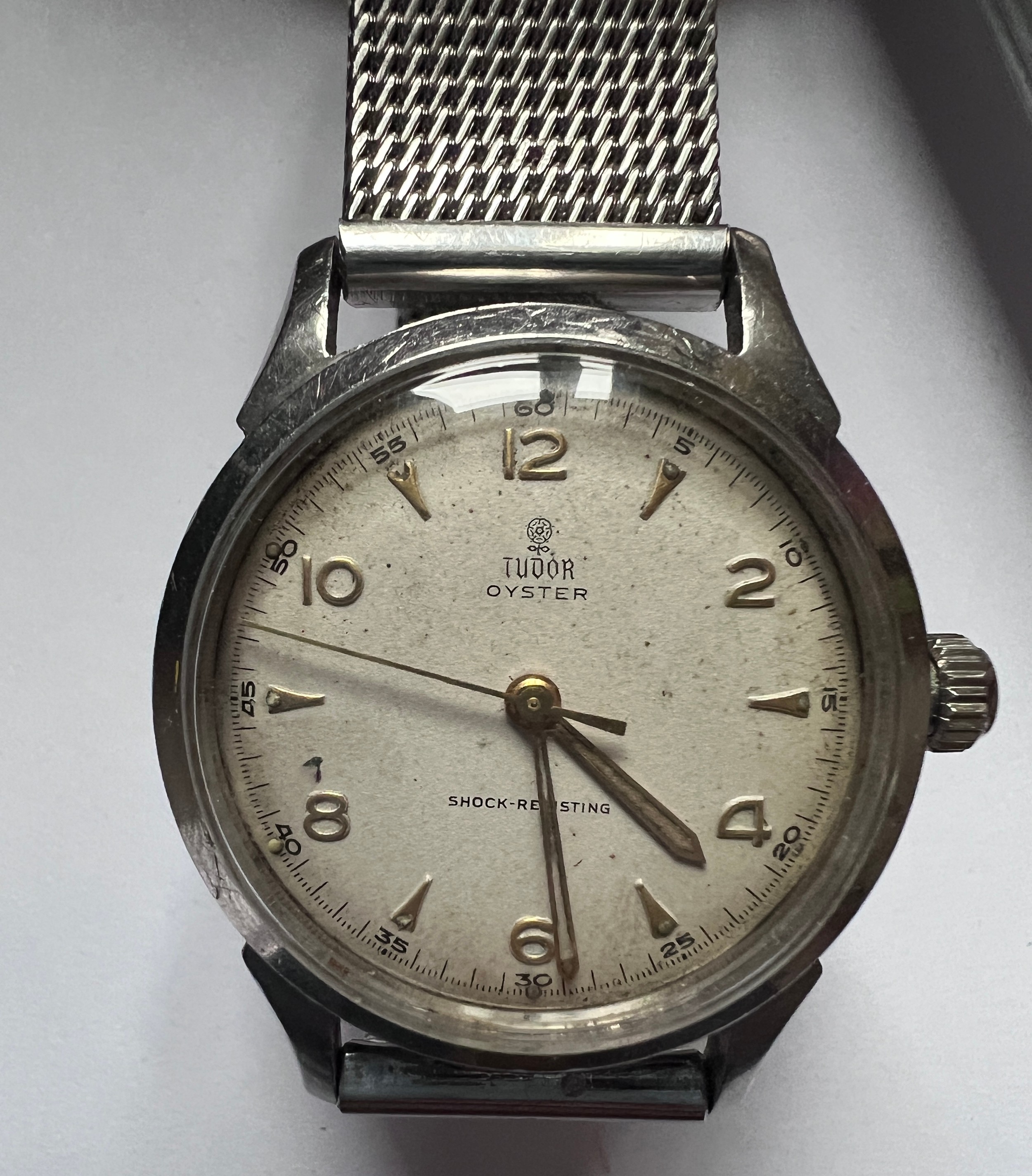 A 1950's Tudor Oyster stainless steel gentleman's wristwatch, gold numerals, gold hands and Rolex