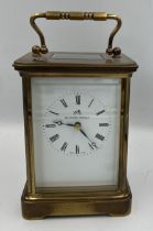 A brass cased Mathew Norman carriage clock with visible escapement. 13.5cm h.