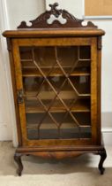 A walnut glazed display cabinet on cabriole legs. 62 w x 30 d x 119cm h.