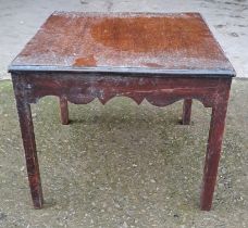 A mahogany side table on square tapered legs. 33 x 38 x 37cm.