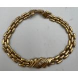 A 9 carat yellow gold bracelet set with single diamond. 19cm length. 7.8gm.