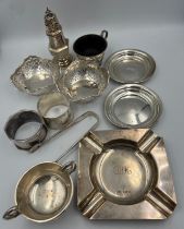 A quantity of hallmarked silver to include two pairs of dishes, ashtray, 2 x napkin rings, 2 x