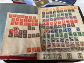 A suitcase containing a large accumulation of world stamps mounted on pages in drawing book and 7
