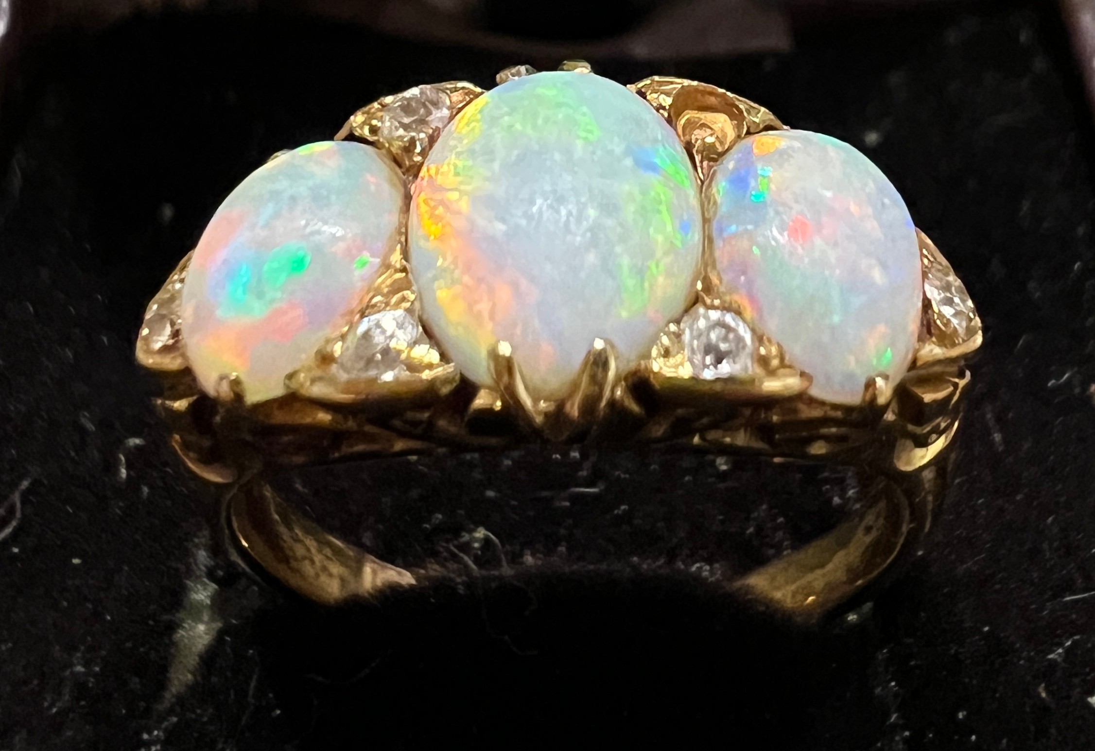 A 19thC 18 carat gold ring set with opals and diamonds. Size L. Weight 4.5gm. - Image 2 of 4