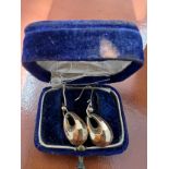 A pair of 9 carat gold earrings in velvet and silk lined case. Weight 1.5gm.