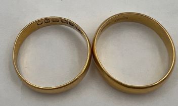Two 22 carat gold wedding bands. Total weight 6.5gm. Sizes N and O.