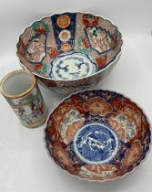 Two 19thC Imari bowls, largest 25cm d and a Chinese vase 12cm h.