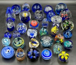 An assortment of paper weights, majority blue, various shapes and sizes, 5 depicting fish, to