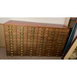 A vintage oak filing cabinet with brass fittings. 149cm w x 38cm d x 86cm h.