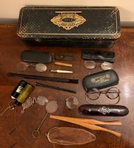 A 19thC leather covered glove box with a miscellany of interesting contents to include spectacles,