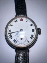 A silver cased trench watch. Inner case marked 925. 334426. Winds and goes. Some marks to dial.