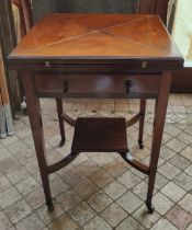 An Edwardian Mahogany fold out envelope card table with draw to front and green baize and four