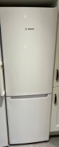 A Bosch fridge/freezer 59cm w x 176cm h.