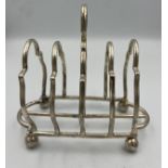 Toast rack London 1911, maker probably the Barnard family. Weight 135gm.