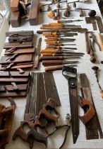 A quantity of vintage tools to include chisels, planes, saws, shoe lasts etc.