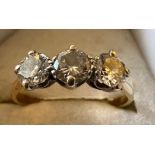 An 18 carat gold ring set with three diamonds. Size J. Weight 1.7gm.