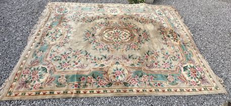 A large oriental wool carpet. 356 x 270cm.