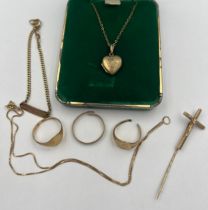 Nine carat gold to include crucifix tie tin, signet ring, heart shaped pendant locket on chain,