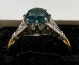 An 18 carat gold ring set with blue zircon. Size Q. Weight 3.5gm.