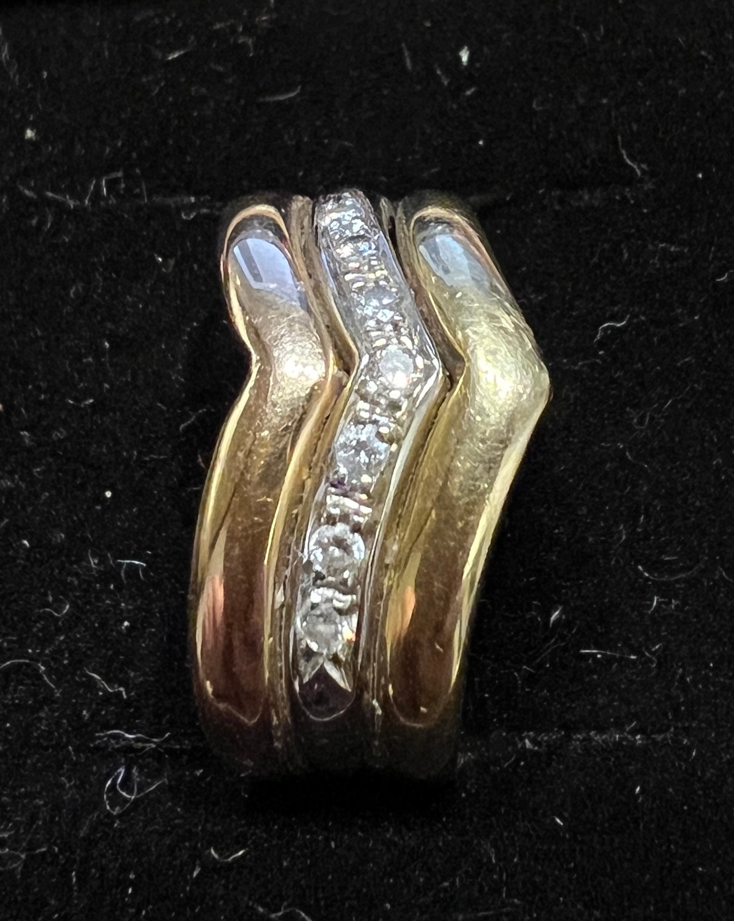 A 18 carat white and yellow gold ring set with a v shaped band of diamonds. Weight 5.3gm. Size M. - Image 3 of 4