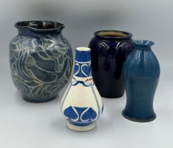 Four blue vases, largest vase with indistinct marks to base 20cm h.