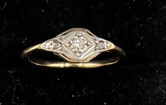 A yellow metal ring set with tiny diamonds. Size F. Weight 1.1gm.