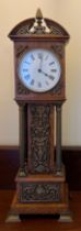 An oak and brass mounted miniature long case clock 46cm h. Works marked R & Co. Paris.