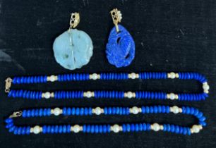 Two lapis lazuli and pearl necklaces with 9 carat gold clasps together with a lapis lazuli carved