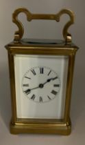 Brass carriage clock made in France for the English market with white enamel dial and visible