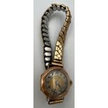 A vintage Ness & Son 9 carat gold cased ladies wristwatch on rolled gold expanding bracelet. Total