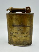 A German brass lighter engraved with figure of a U-boat and U162 Jürgen Wattenberg. Approx. 10cm h x