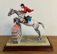 Border Fine Arts - 'Show Jumping' model No. B0366. 210/850. By Rob Donaldson on wood base, with