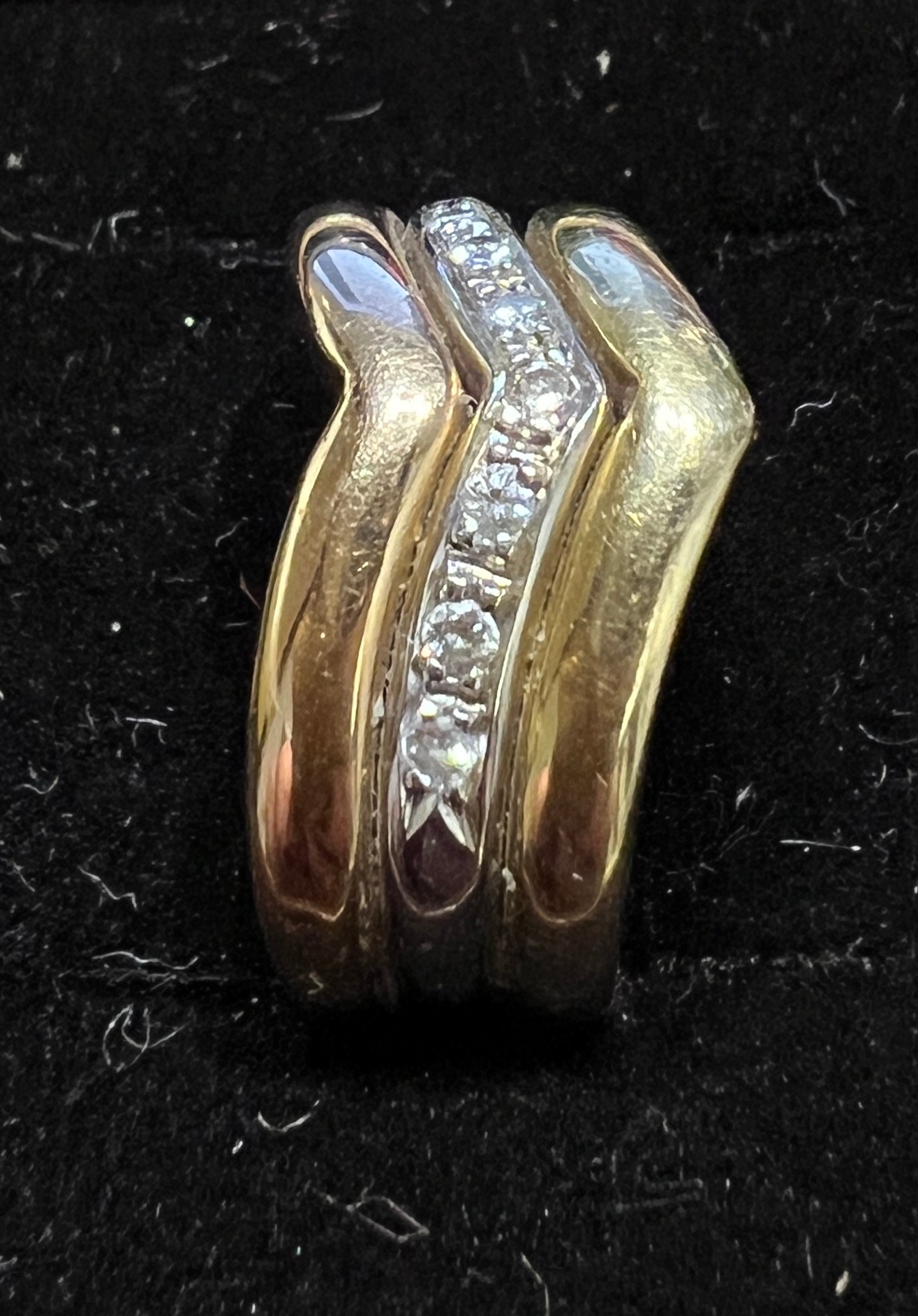 A 18 carat white and yellow gold ring set with a v shaped band of diamonds. Weight 5.3gm. Size M. - Image 2 of 4