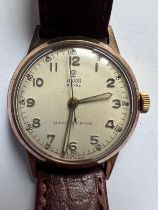 A 1950's Tudor Royal 9ct gold wristwatch on camel grain leather strap. Stamped to inner case