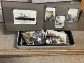 A miscellany to include early 20thC photograph album and a box of loose photographs, silver