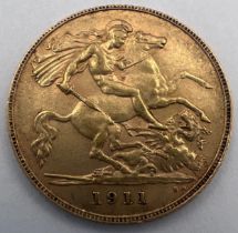 A George V 1911 half gold sovereign. 4gm.