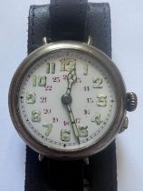 A vintage military trench watch in sterling silver, luminous hands and numbers. 35mm. Winds and