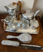 A piquot ware tea set on tray together with a silver backed hairbrush, clothes brush and comb,