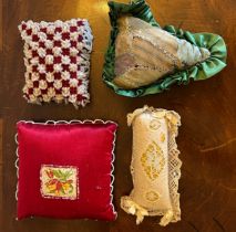 Four 19thC pincushions to include beadwork and patchwork, together with ostrich feather trims,