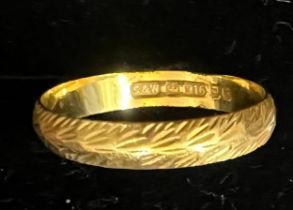 A 22 carat gold wedding band marked .916. Size J. Weight 1.6gm.