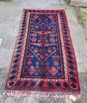 A good quality rug in shades of blue and red. 290cm x 80cm.