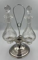 A French .950 silver stand by Aristide Leclerc (1900-1929) containing glass oil and vinegar