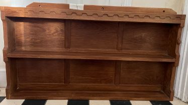 A Peter Rabbitman Heap of Wetwang oak plate rack with panelled back and carved signature rabbit.
