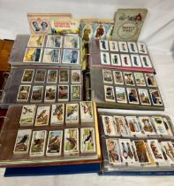 A quantity of 6 albums of cigarette cards to include various topics, Football, Birds, Sportsmen,