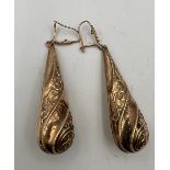 A pair of 9 carat gold drop earrings. Length 5.5cm approximately. Weight 2.8gm.