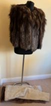 A vintage fox fur cape and two fur stoles, one cream and one brown.
