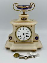 A French marble mantle clock with enamel decoration and movement signed D.C.&.Cie. Key and pendulum.