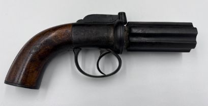 A pepper pot percussion cap six-shot pistol with walnut stock and engraved decoration.