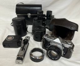 A Olympus OM1 MD 35mm film camera, two Olympus lenses, OM 35mm & 135mm, a Photax 231 flash