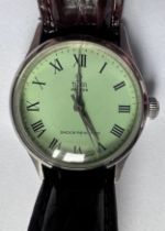 A 1940's gentleman's Tudor Oyster Shock Resisting wristwatch on brown leather strap and green
